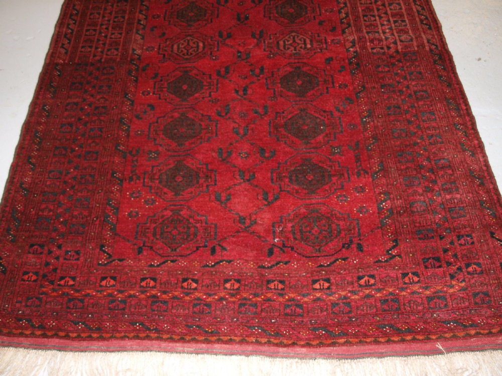OLD AFGHAN VILLAGE RUG WITH TURKMEN CHUVAL GUL DESIGN, PLUM RED COLOUR, CIRCA 1920. View VII