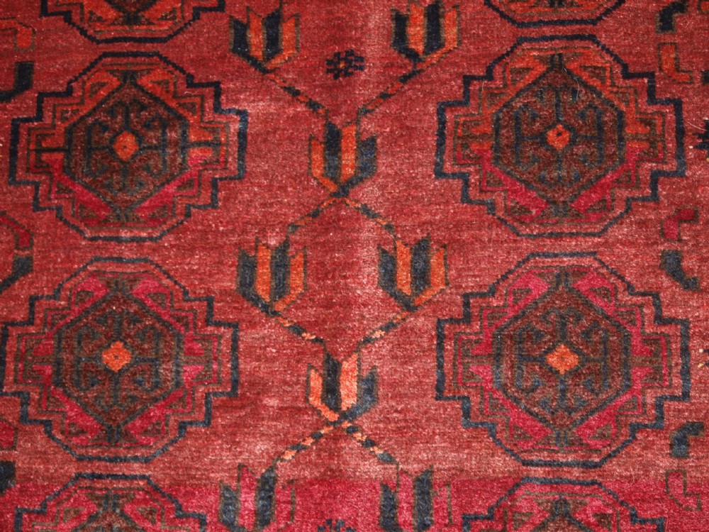OLD AFGHAN VILLAGE RUG WITH TURKMEN CHUVAL GUL DESIGN, PLUM RED COLOUR, CIRCA 1920. View VIII