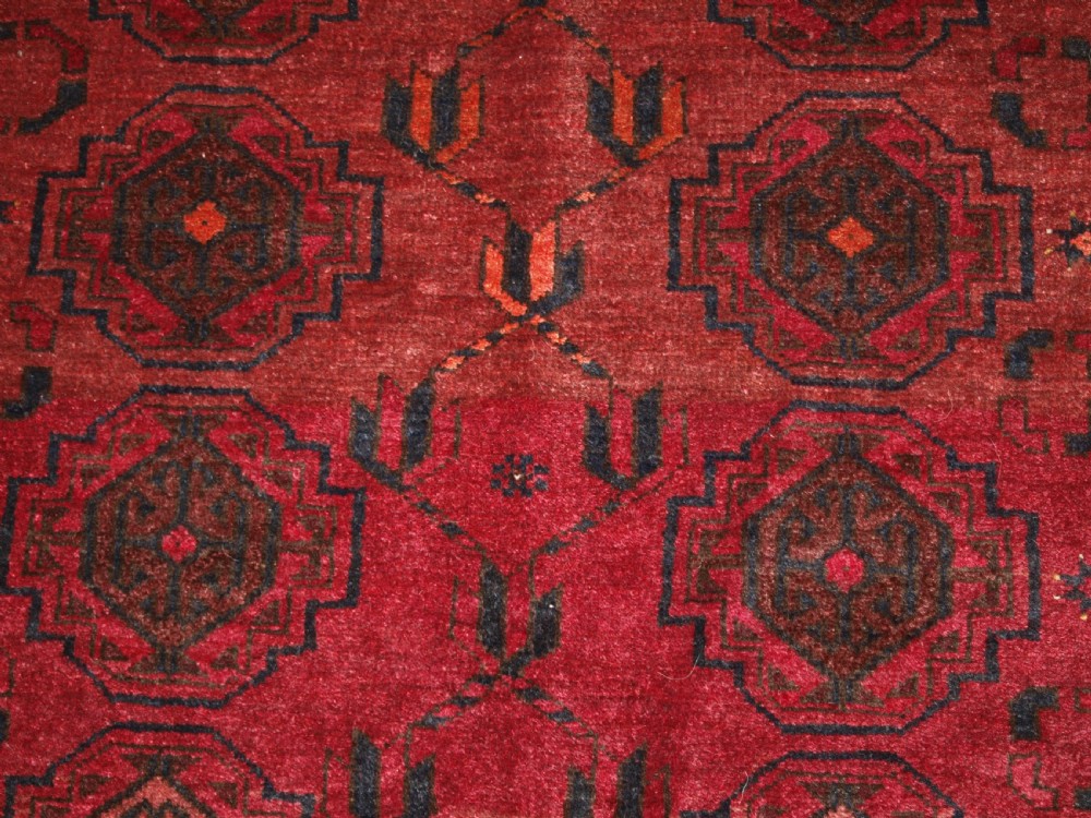 OLD AFGHAN VILLAGE RUG WITH TURKMEN CHUVAL GUL DESIGN, PLUM RED COLOUR, CIRCA 1920. View IX