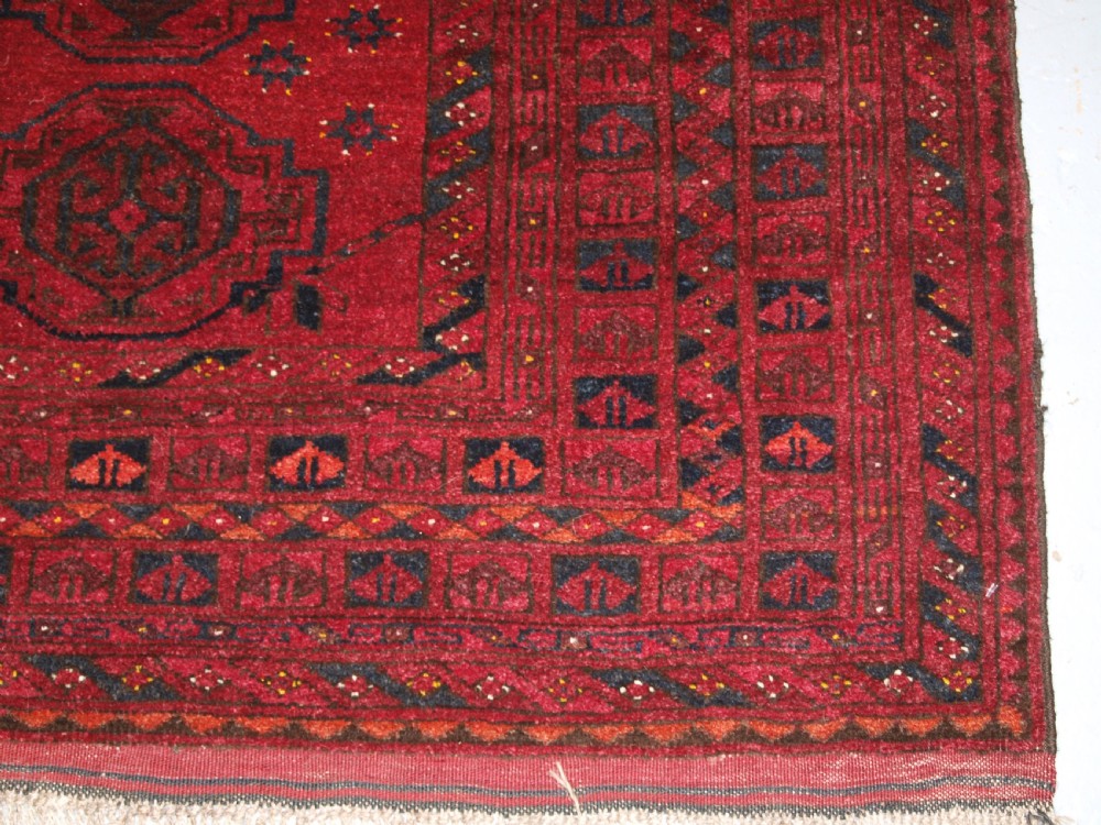 OLD AFGHAN VILLAGE RUG WITH TURKMEN CHUVAL GUL DESIGN, PLUM RED COLOUR, CIRCA 1920. View XI
