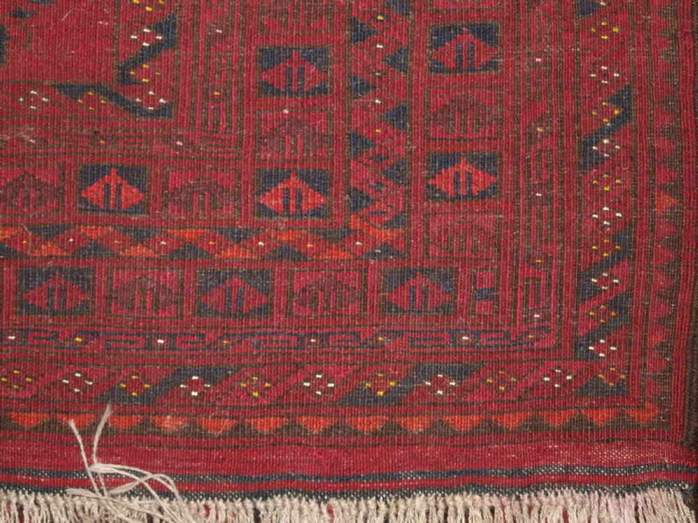 OLD AFGHAN VILLAGE RUG WITH TURKMEN CHUVAL GUL DESIGN, PLUM RED COLOUR, CIRCA 1920. View XII