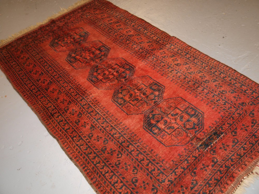 OLD NORTH AFGHAN VILLAGE RUG WITH SUPERB COLOUR, LOW PRICE DUE TO OLD REPAIR, CIRCA 1920. View II