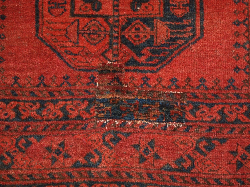 OLD NORTH AFGHAN VILLAGE RUG WITH SUPERB COLOUR, LOW PRICE DUE TO OLD REPAIR, CIRCA 1920. View X