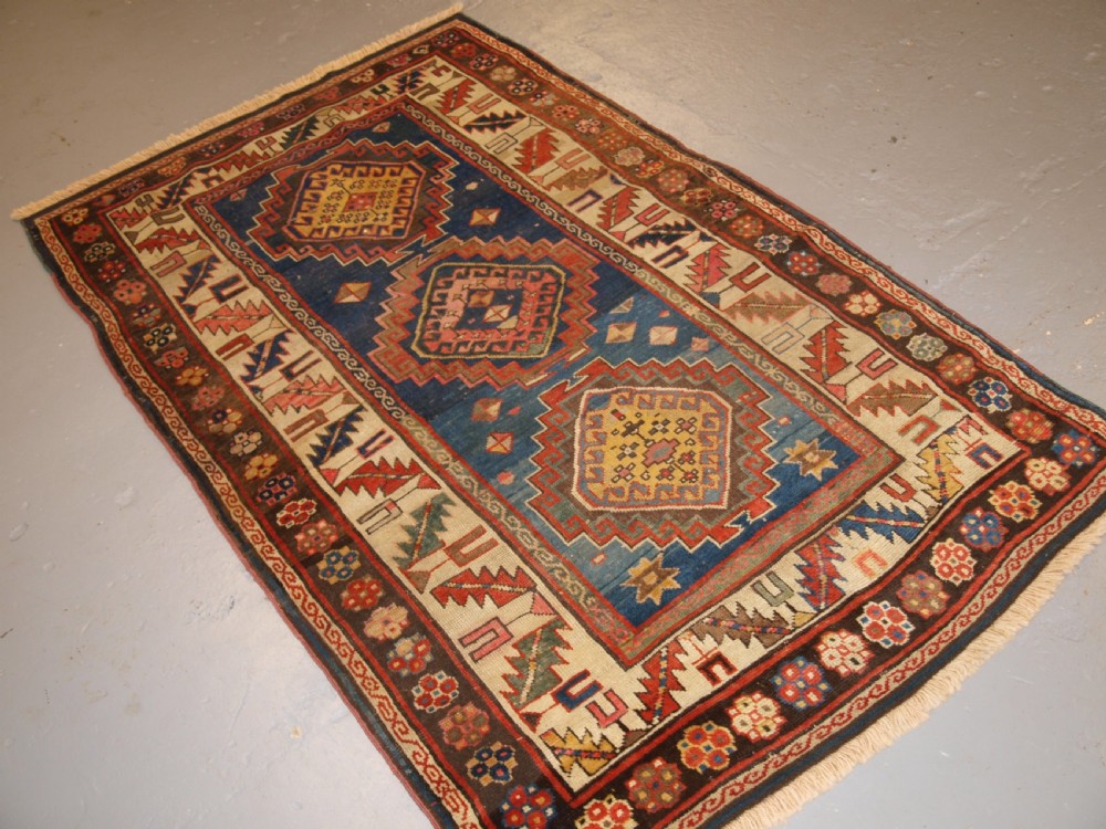 ANTIQUE CAUCASIAN KAZAK THREE MEDALLION RUG WITH SUPERB SOFT COLOURS, CIRCA 1900. View II
