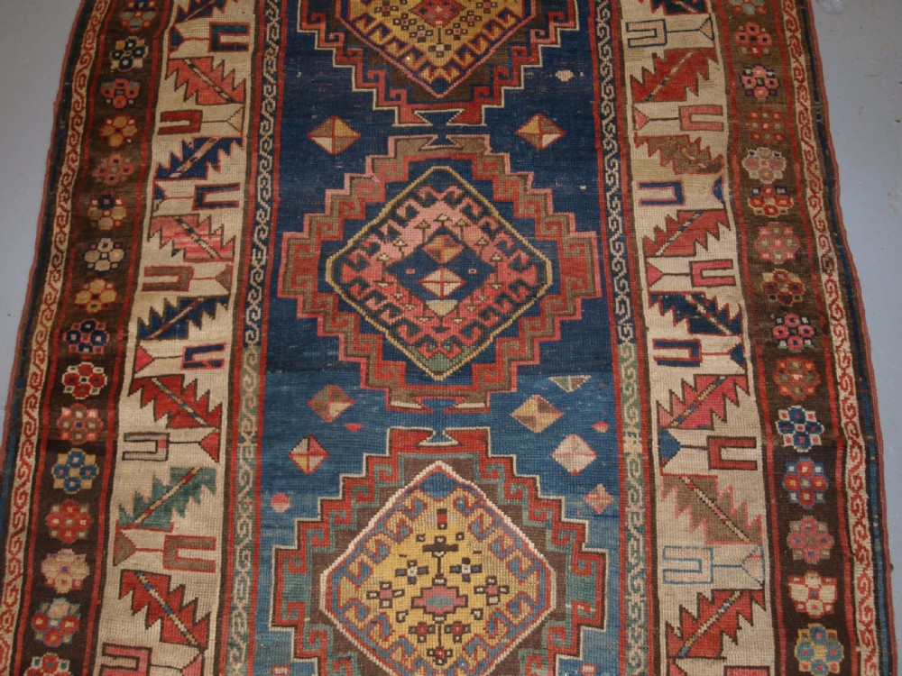 ANTIQUE CAUCASIAN KAZAK THREE MEDALLION RUG WITH SUPERB SOFT COLOURS, CIRCA 1900. View IV