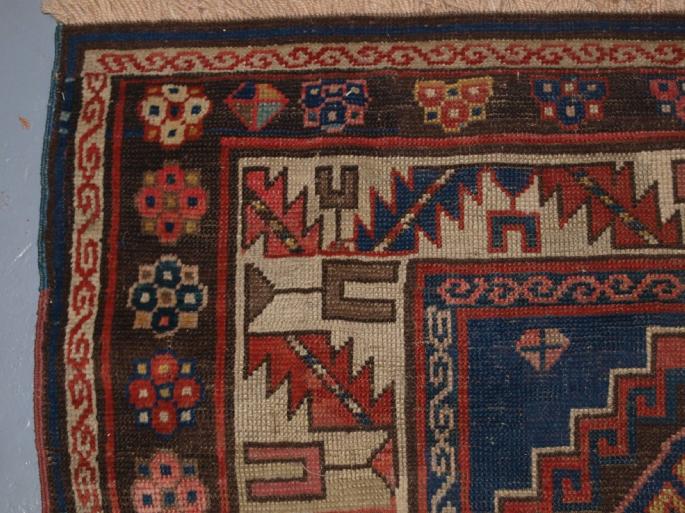 ANTIQUE CAUCASIAN KAZAK THREE MEDALLION RUG WITH SUPERB SOFT COLOURS, CIRCA 1900. View VI
