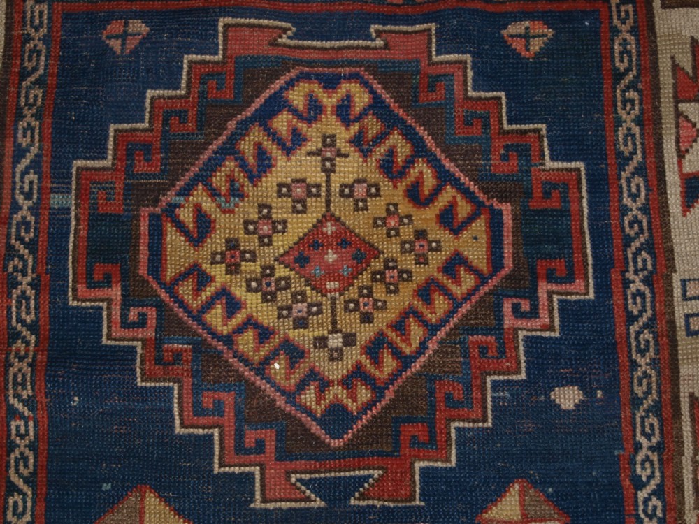 ANTIQUE CAUCASIAN KAZAK THREE MEDALLION RUG WITH SUPERB SOFT COLOURS, CIRCA 1900. View VIII