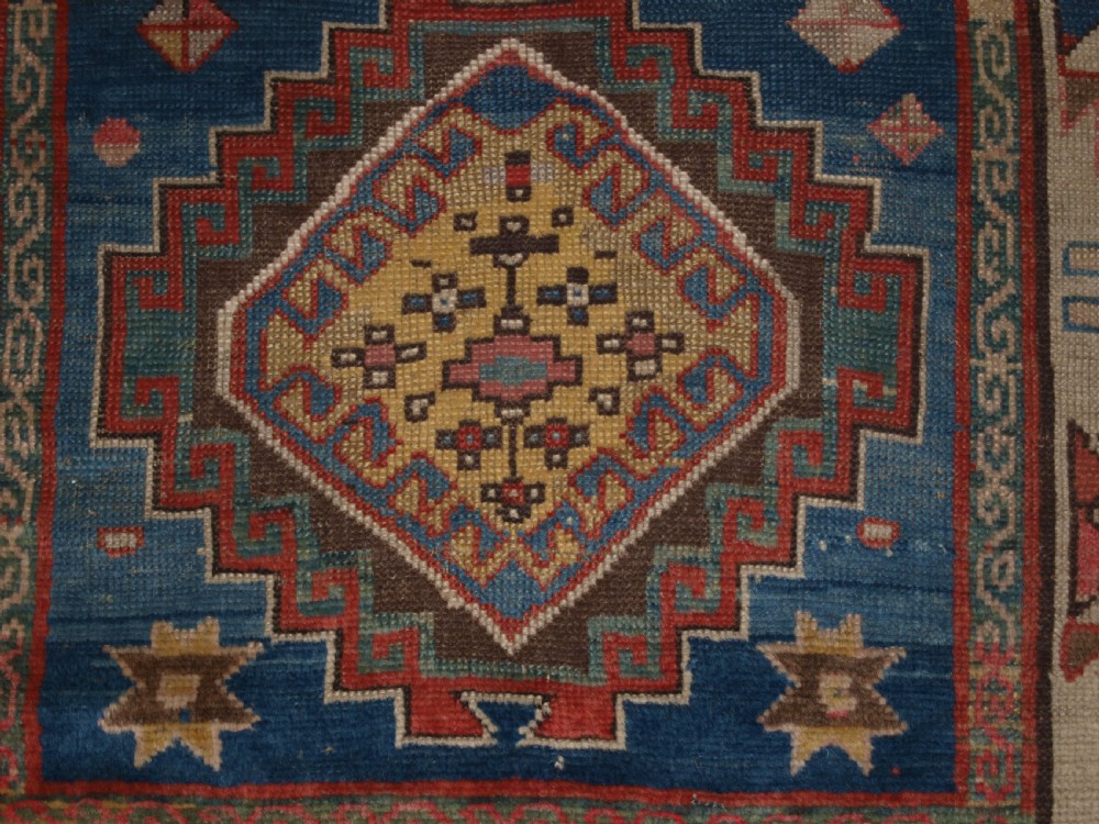 ANTIQUE CAUCASIAN KAZAK THREE MEDALLION RUG WITH SUPERB SOFT COLOURS, CIRCA 1900. View IX