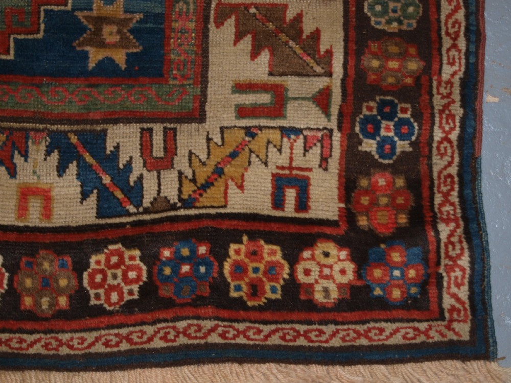 ANTIQUE CAUCASIAN KAZAK THREE MEDALLION RUG WITH SUPERB SOFT COLOURS, CIRCA 1900. View X