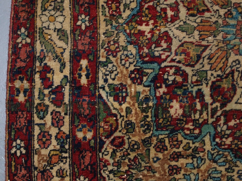 ANTIQUE PERSIAN KIRMAN RUG OF SMALL SIZE, FINE WEAVE AND PLEASING COLOUR, CIRCA 1900. View II