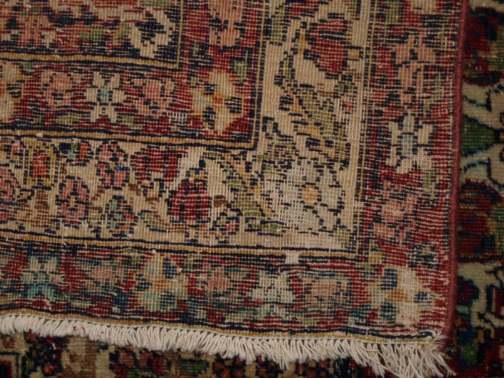 ANTIQUE PERSIAN KIRMAN RUG OF SMALL SIZE, FINE WEAVE AND PLEASING COLOUR, CIRCA 1900. View IX