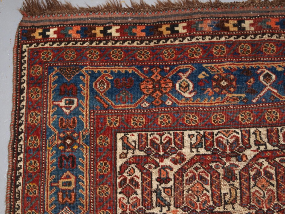 ANTIQUE RUG BY THE KHAMSEH TRIBE, ALL OVER BOTEH DESIGN ON AN IVORY FIELD, CIRCA 1900. View III