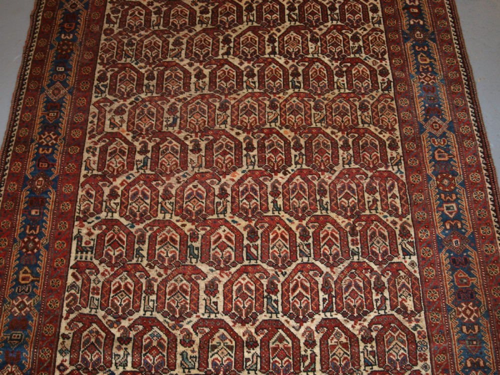 ANTIQUE RUG BY THE KHAMSEH TRIBE, ALL OVER BOTEH DESIGN ON AN IVORY FIELD, CIRCA 1900. View VI