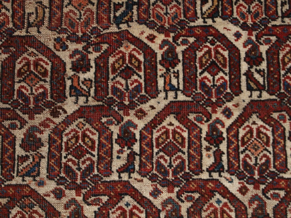 ANTIQUE RUG BY THE KHAMSEH TRIBE, ALL OVER BOTEH DESIGN ON AN IVORY FIELD, CIRCA 1900. View VIII