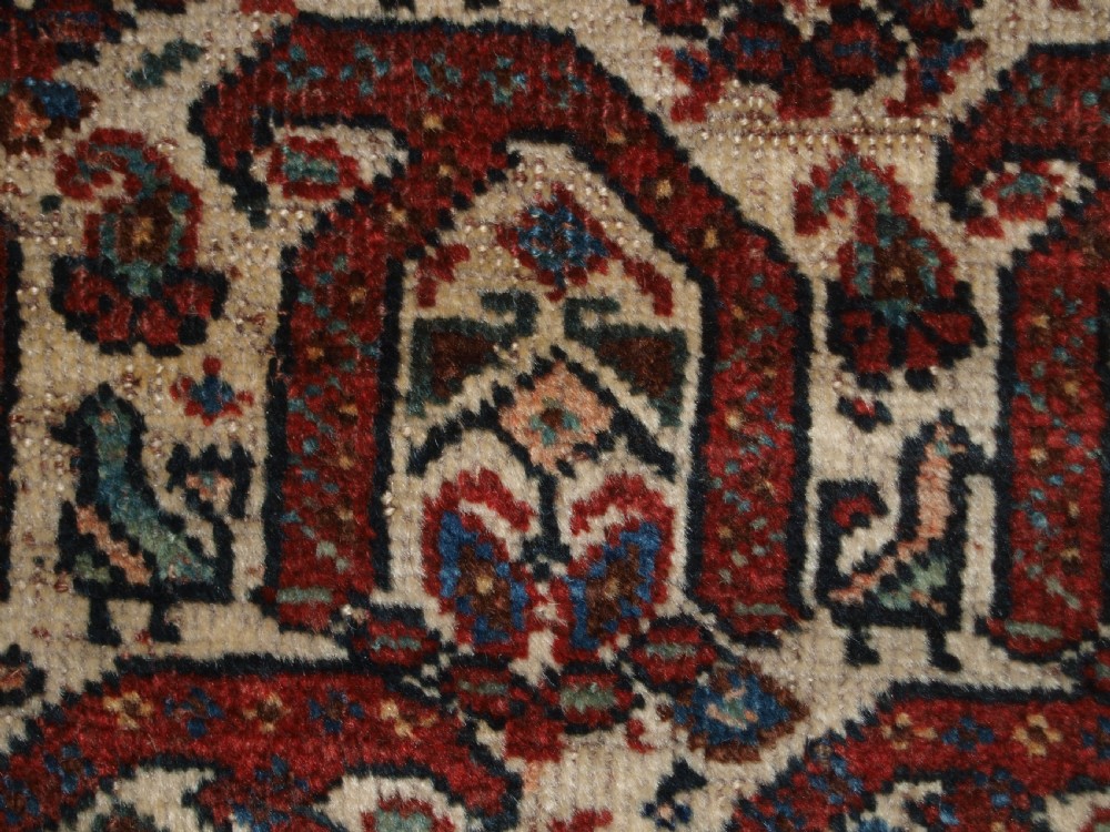 ANTIQUE RUG BY THE KHAMSEH TRIBE, ALL OVER BOTEH DESIGN ON AN IVORY FIELD, CIRCA 1900. View XI