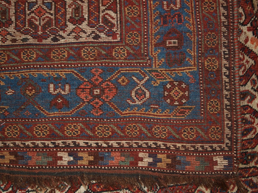 ANTIQUE RUG BY THE KHAMSEH TRIBE, ALL OVER BOTEH DESIGN ON AN IVORY FIELD, CIRCA 1900. View XII