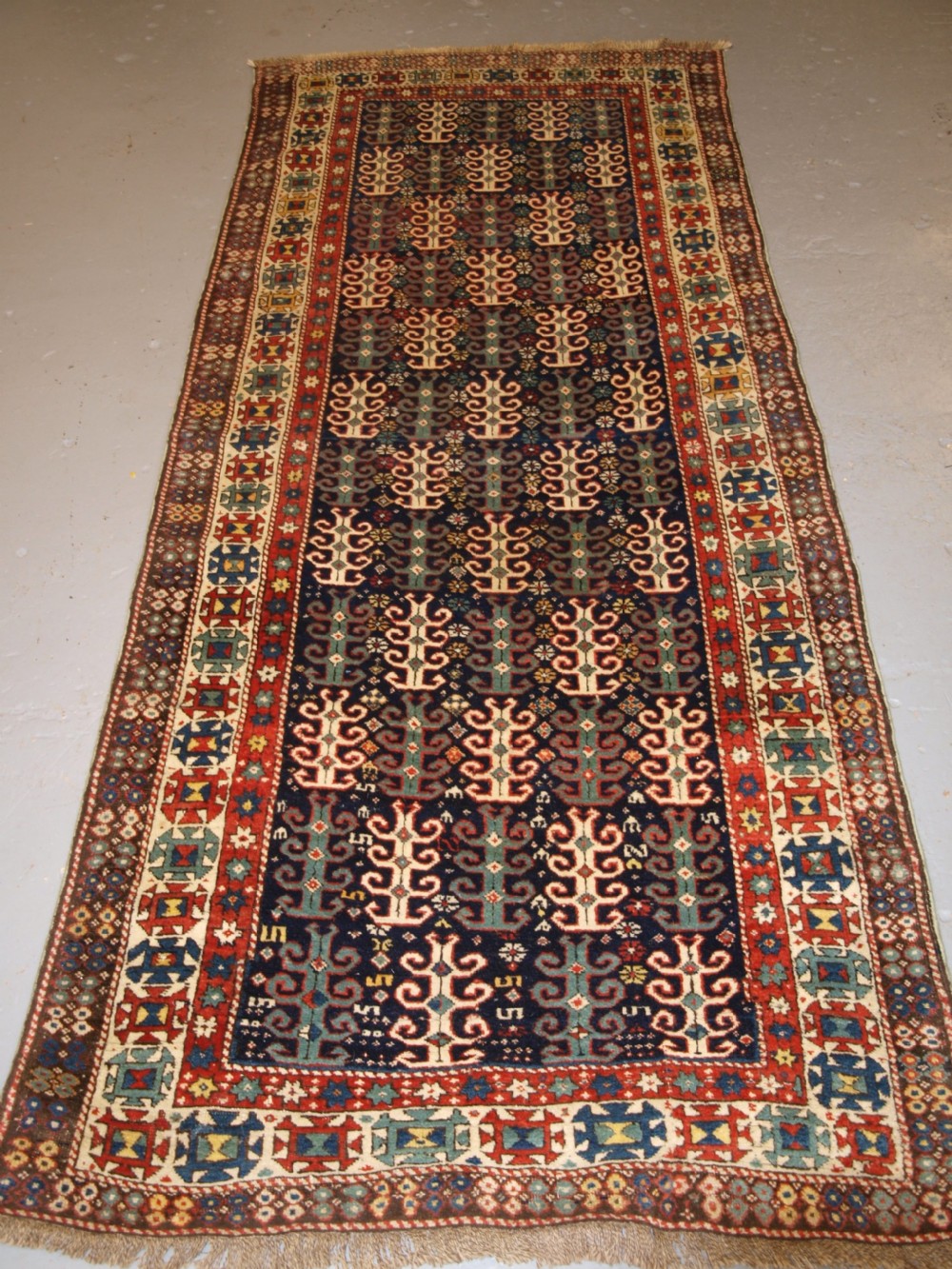 ANTIQUE CAUCASIAN LONG RUG WITH SCARCE DESIGN, PROBABLY GENDJE REGION, LATE 19TH CENTURY.