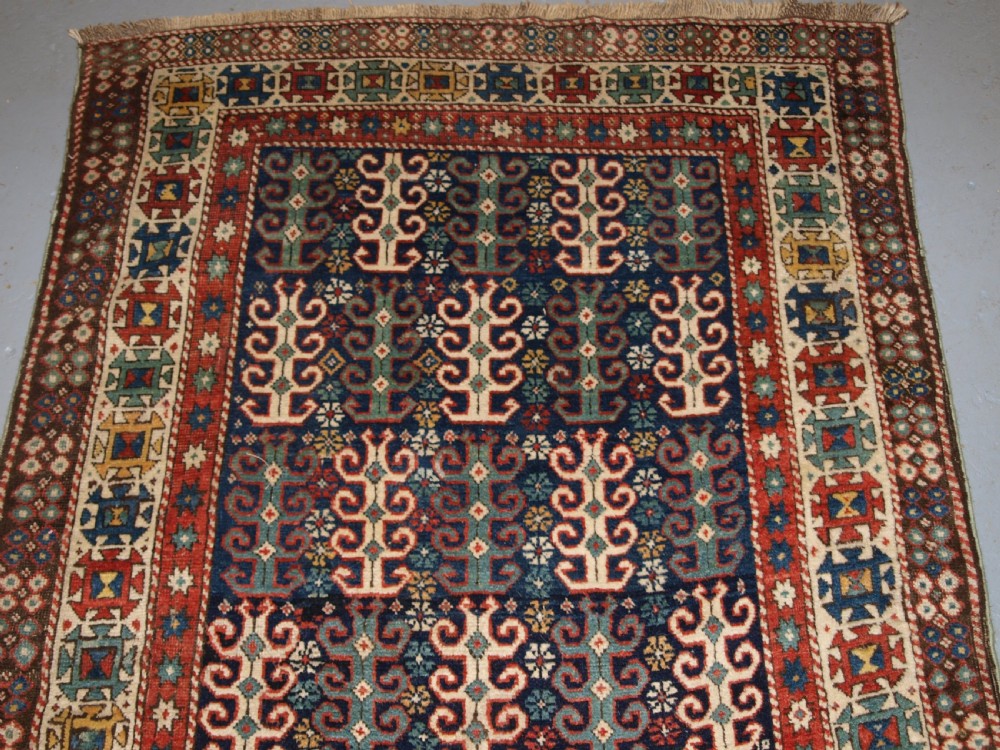 ANTIQUE CAUCASIAN LONG RUG WITH SCARCE DESIGN, PROBABLY GENDJE REGION, LATE 19TH CENTURY. View IV
