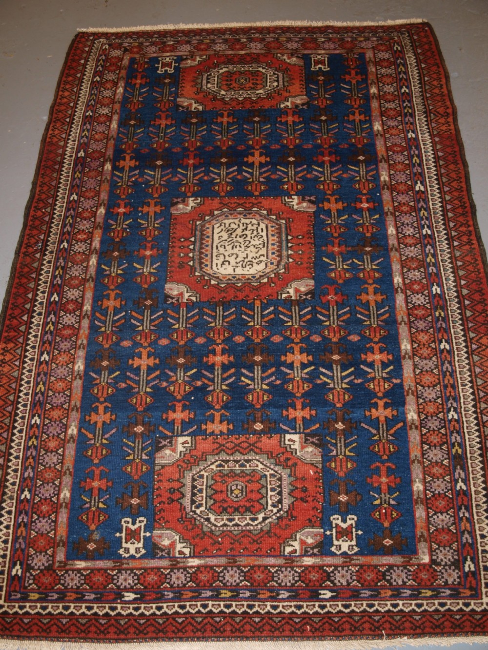 OLD KURDISH RUG, UNUSUAL DESIGN, LARGE INSCRIPTION WITH DATE, CIRCA 1900/20.