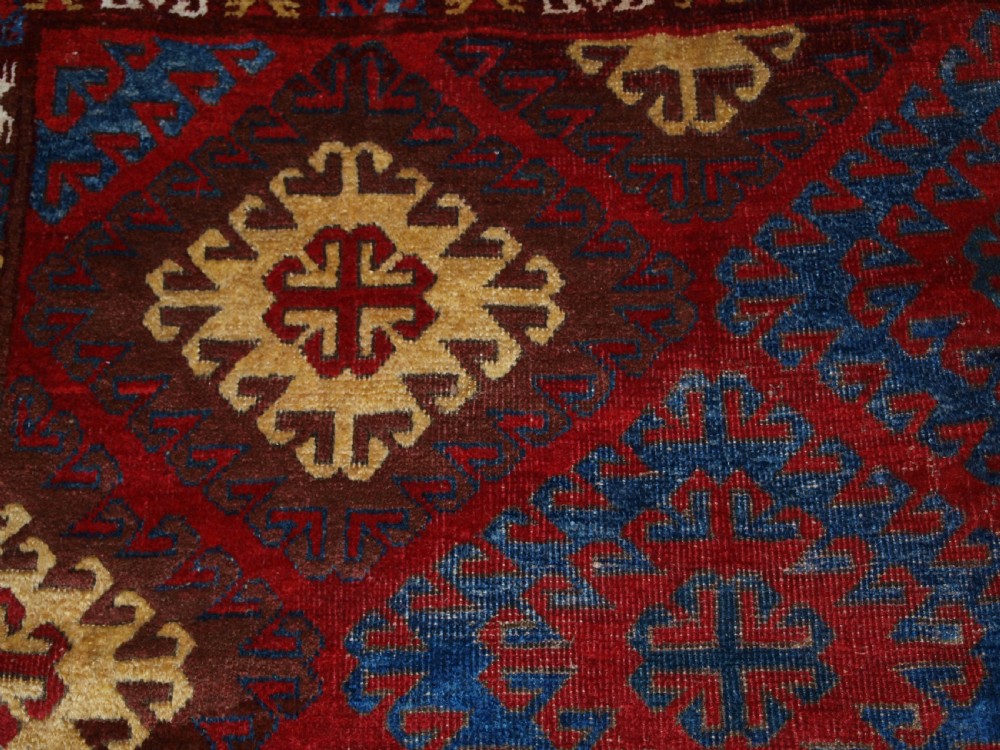 VERY RARE SMALL MAIN CARPET, CENTRAL ASIAN KIRGHYZ OR TURKMEN, MID 19TH CENTURY OR EARLIER. View XII