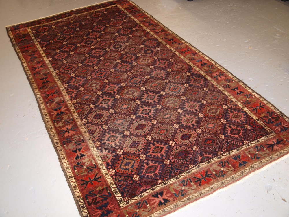 ANTIQUE BALUCH RUG WITH SNOW FLAKE LATTICE DESIGN, WESTERN AFGHANISTAN, LATE 19TH CENTURY.