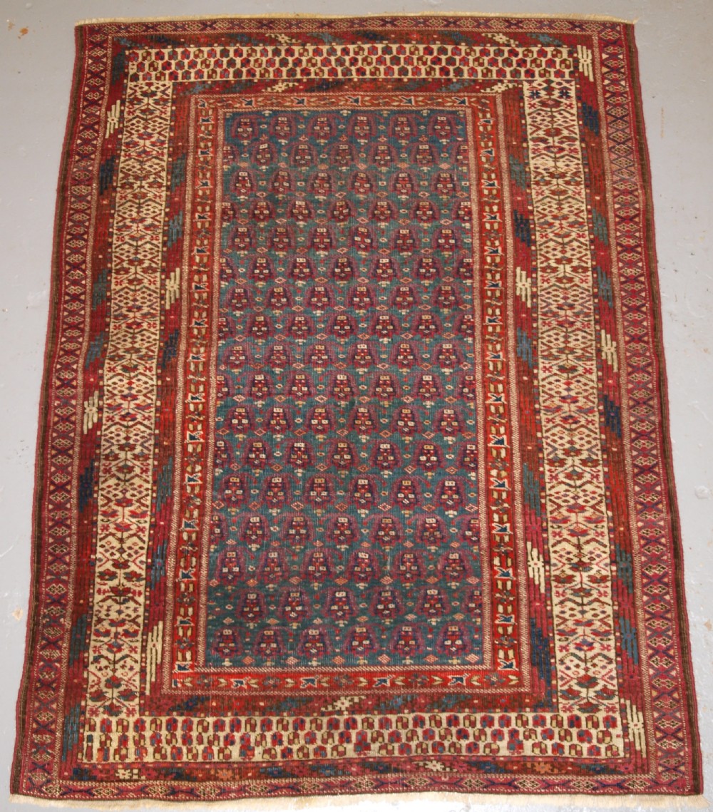ANTIQUE YOMUT OR TEKKE TURKMEN BLUE GROUND DOWRY RUG OF RARE FORMAT, CIRCA 1900.