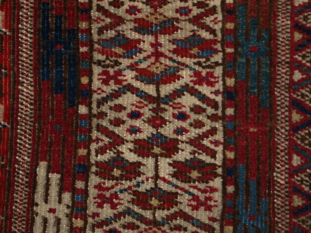 ANTIQUE YOMUT OR TEKKE TURKMEN BLUE GROUND DOWRY RUG OF RARE FORMAT, CIRCA 1900. View X