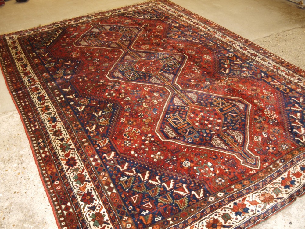OLD SOUTH WEST PERSIAN SHIRAZ REGION TRIPLE MEDALLION CARPET WITH TRIBAL DESIGN, GREAT CONDITION, CIRCA 1920.