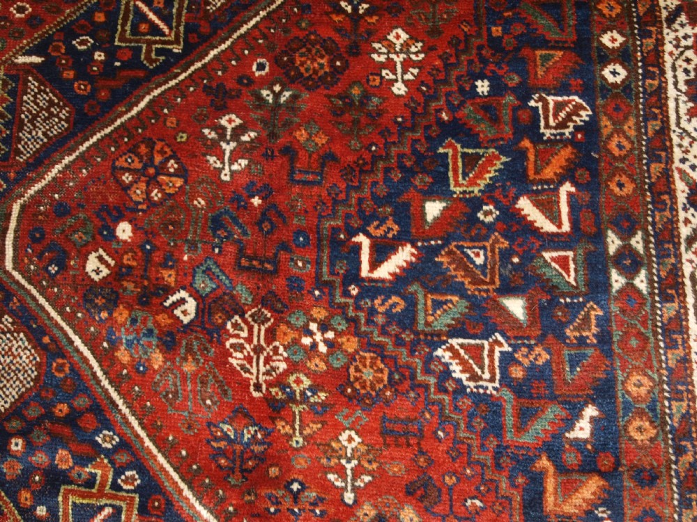 OLD SOUTH WEST PERSIAN SHIRAZ REGION TRIPLE MEDALLION CARPET WITH TRIBAL DESIGN, GREAT CONDITION, CIRCA 1920. View X