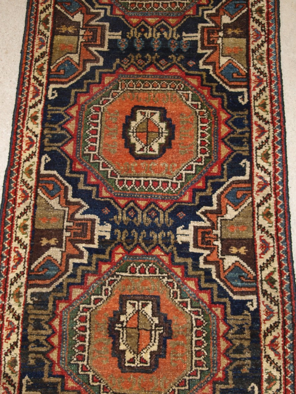 ANTIQUE PERSIAN RUNNER BY THE LURI TRIBE, UNUSUAL DESIGN WITH TURKMEN GULS, NARROW SMALL SIZE, CIRCA 1900. View V