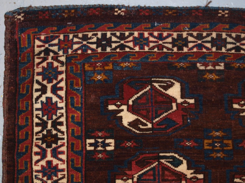 ANTIQUE YOMUT TURKMEN 9 GUL CHUVAL WITH PLAIN WEAVE BACK, LATE 19TH CENTURY. View II