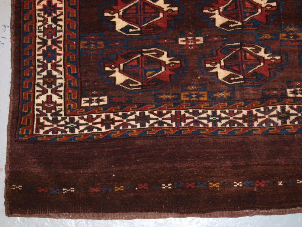 ANTIQUE YOMUT TURKMEN 9 GUL CHUVAL WITH PLAIN WEAVE BACK, LATE 19TH CENTURY. View III