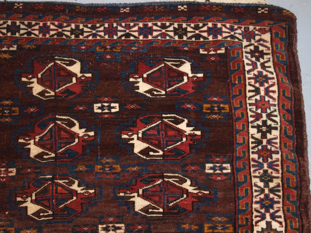 ANTIQUE YOMUT TURKMEN 9 GUL CHUVAL WITH PLAIN WEAVE BACK, LATE 19TH CENTURY. View IV