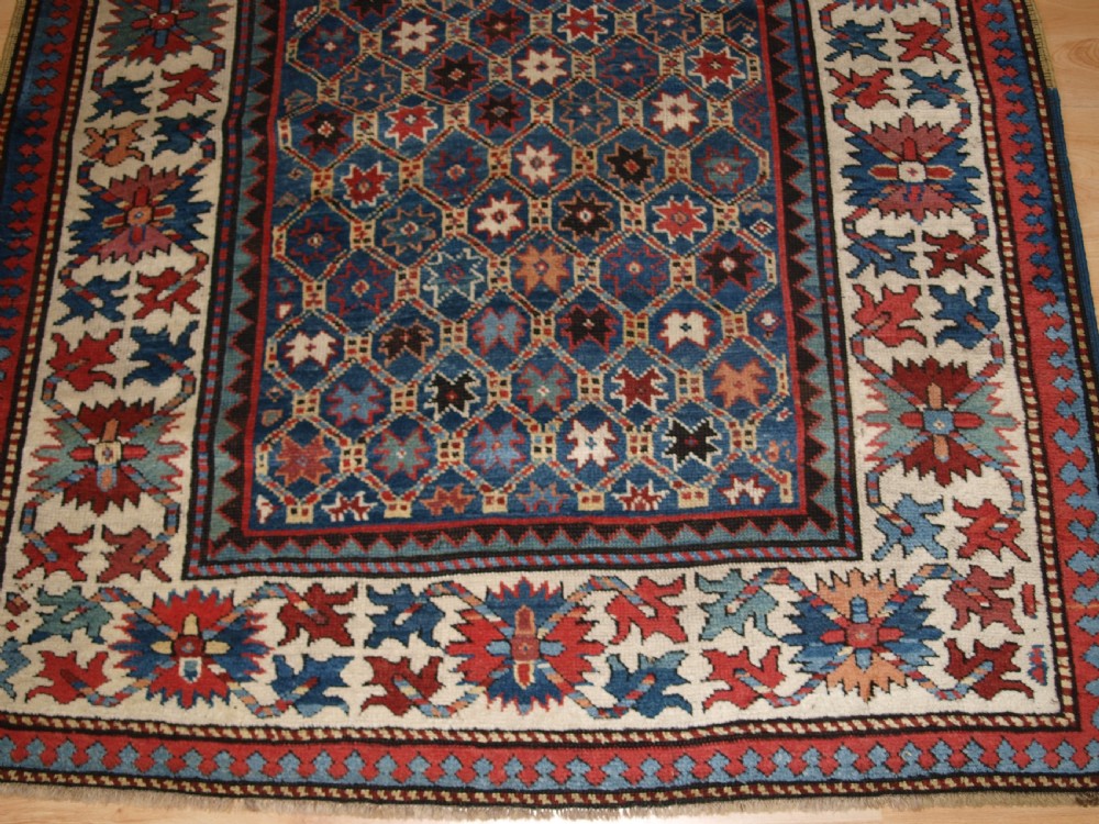 ANTIQUE CAUCASIAN GENDJE KAZAK RUG, LATTICE AND STAR DESIGN, CIRCA 1880. View VII