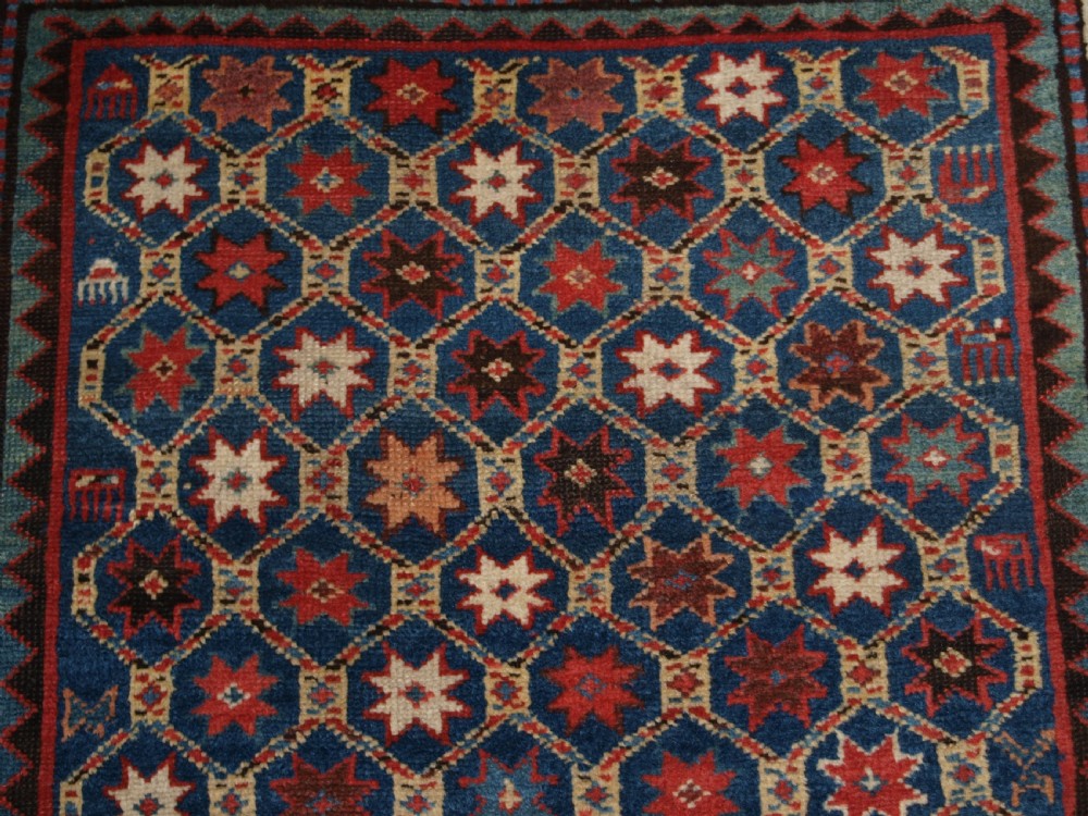 ANTIQUE CAUCASIAN GENDJE KAZAK RUG, LATTICE AND STAR DESIGN, CIRCA 1880. View IX