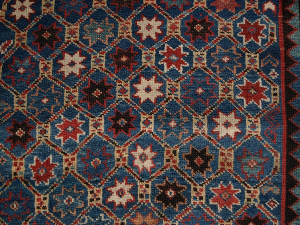 ANTIQUE CAUCASIAN GENDJE KAZAK RUG, LATTICE AND STAR DESIGN, CIRCA 1880. View XI