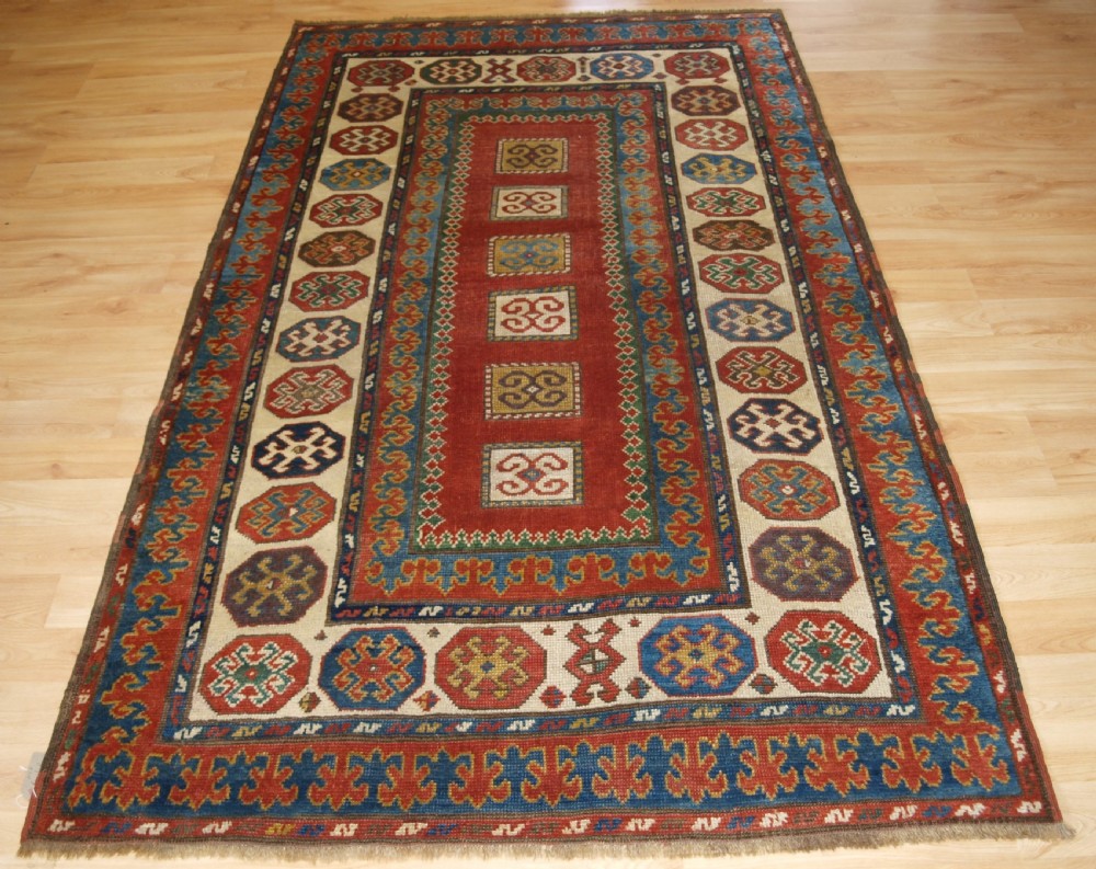 ANTIQUE CAUCASIAN KAZAK RUG OF COMPARTMENT DESIGN, BORDJALOU AREA, CIRCA 1890.