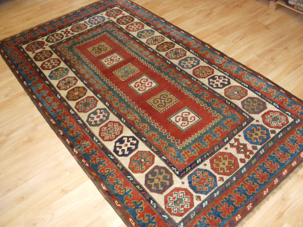 ANTIQUE CAUCASIAN KAZAK RUG OF COMPARTMENT DESIGN, BORDJALOU AREA, CIRCA 1890. View II