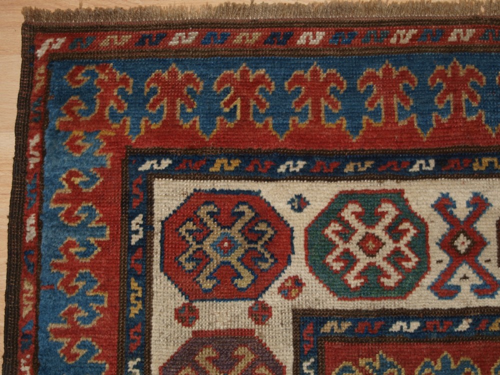 ANTIQUE CAUCASIAN KAZAK RUG OF COMPARTMENT DESIGN, BORDJALOU AREA, CIRCA 1890. View III
