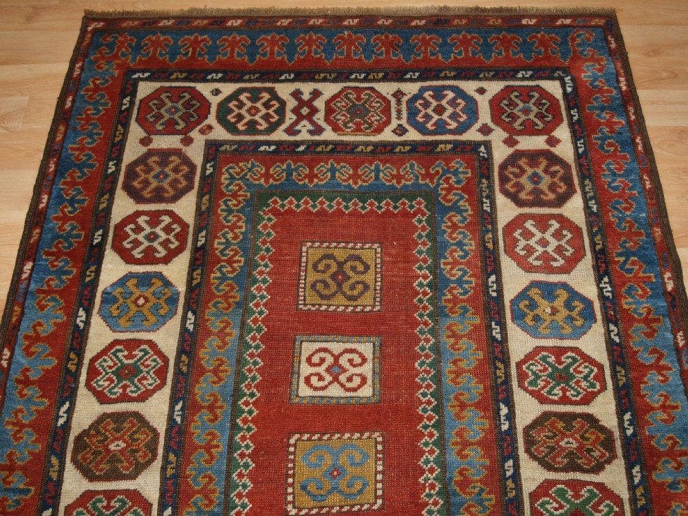 ANTIQUE CAUCASIAN KAZAK RUG OF COMPARTMENT DESIGN, BORDJALOU AREA, CIRCA 1890. View V