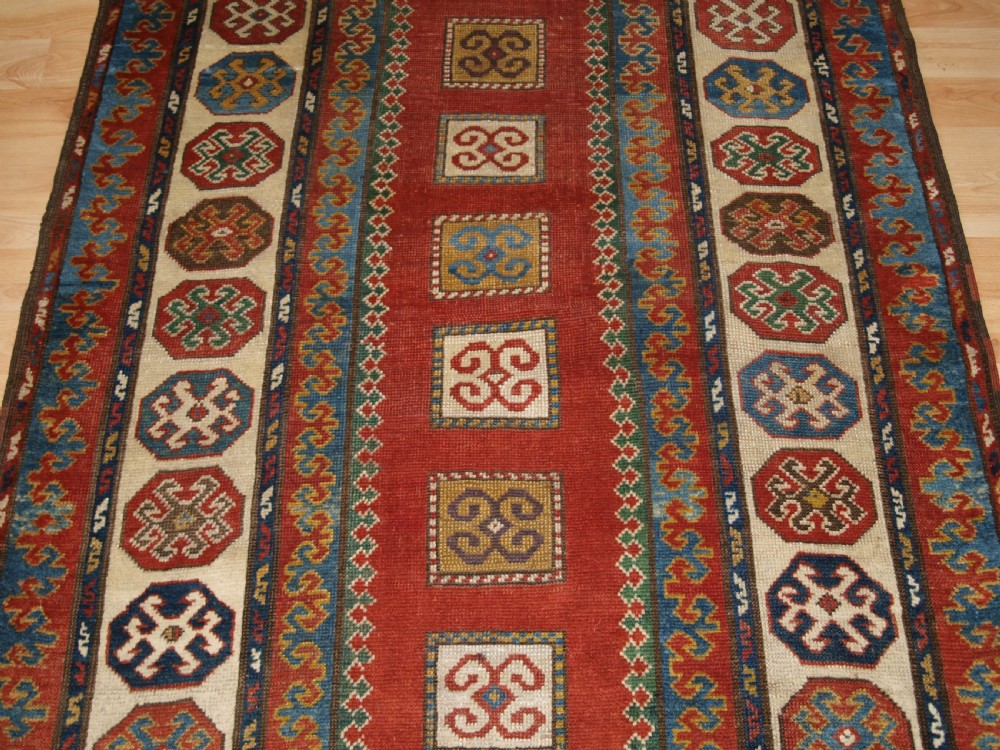 ANTIQUE CAUCASIAN KAZAK RUG OF COMPARTMENT DESIGN, BORDJALOU AREA, CIRCA 1890. View VI