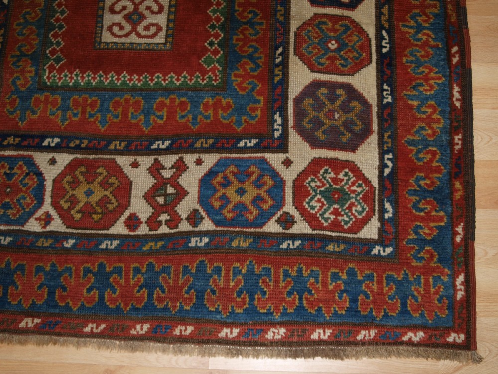 ANTIQUE CAUCASIAN KAZAK RUG OF COMPARTMENT DESIGN, BORDJALOU AREA, CIRCA 1890. View IX
