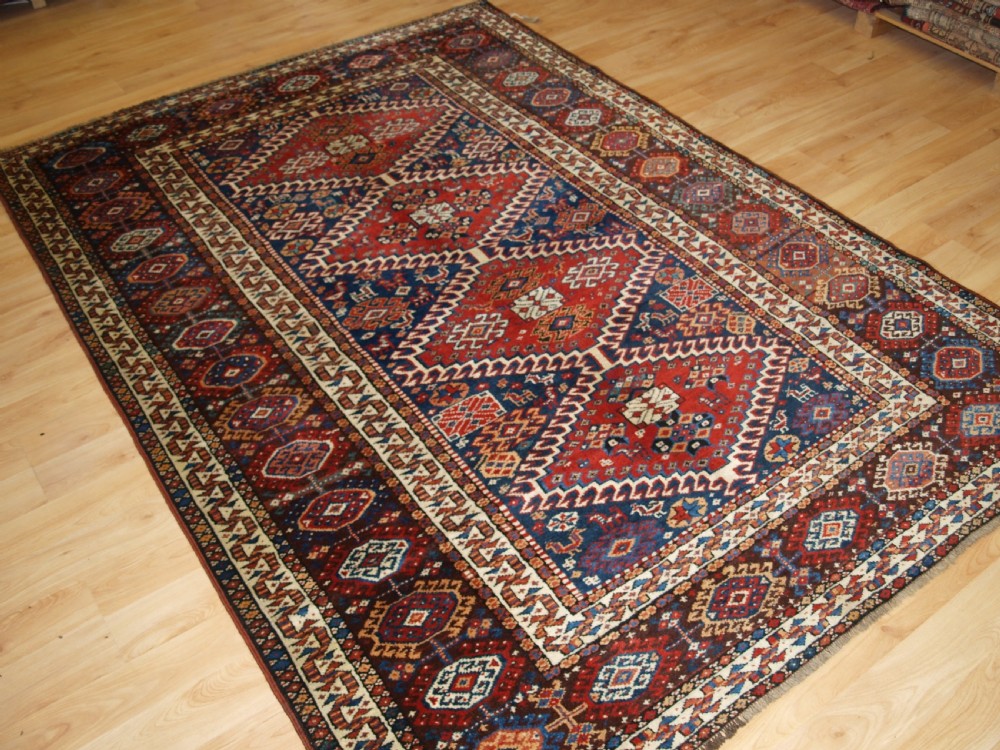 ANTIQUE RUG BY THE LURI TRIB, OUTSTANDING CONDITION, CIRCA 1900.