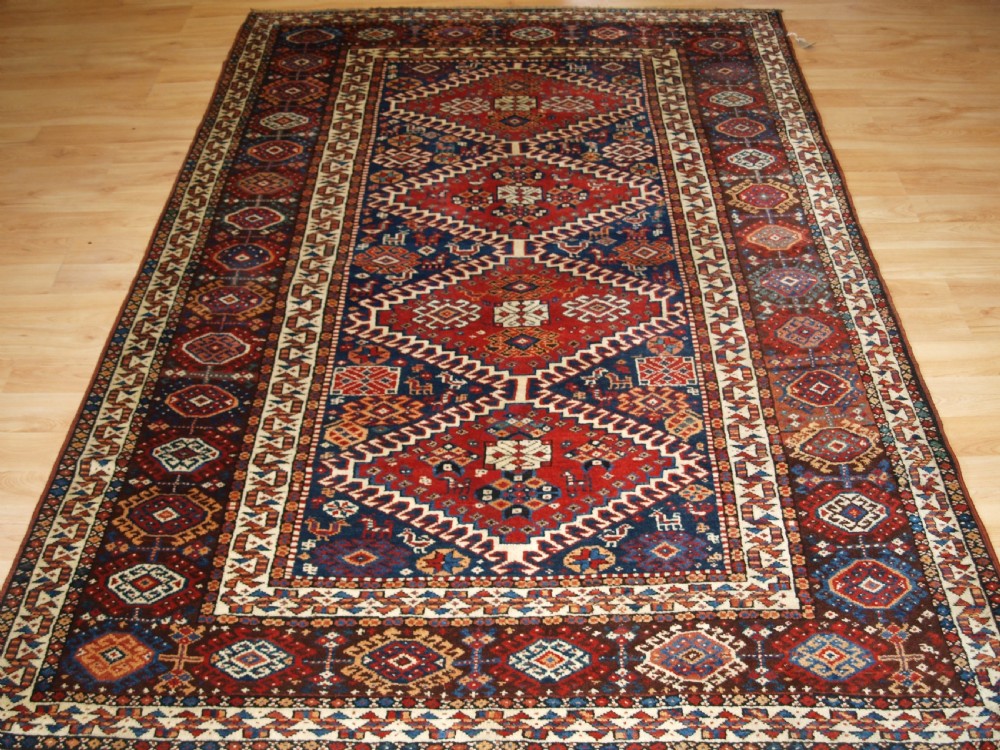 ANTIQUE RUG BY THE LURI TRIB, OUTSTANDING CONDITION, CIRCA 1900. View II