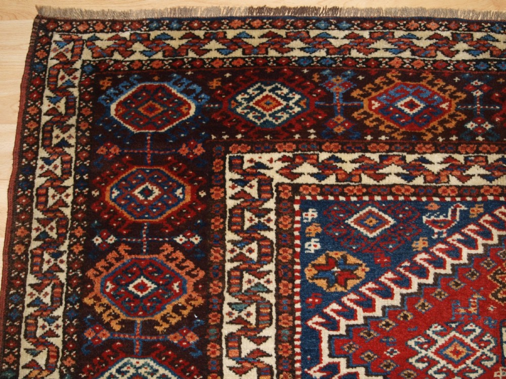 ANTIQUE RUG BY THE LURI TRIB, OUTSTANDING CONDITION, CIRCA 1900. View III