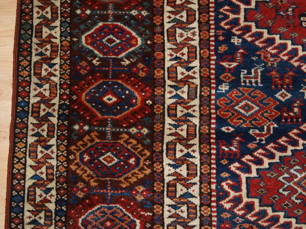 ANTIQUE RUG BY THE LURI TRIB, OUTSTANDING CONDITION, CIRCA 1900. View IV