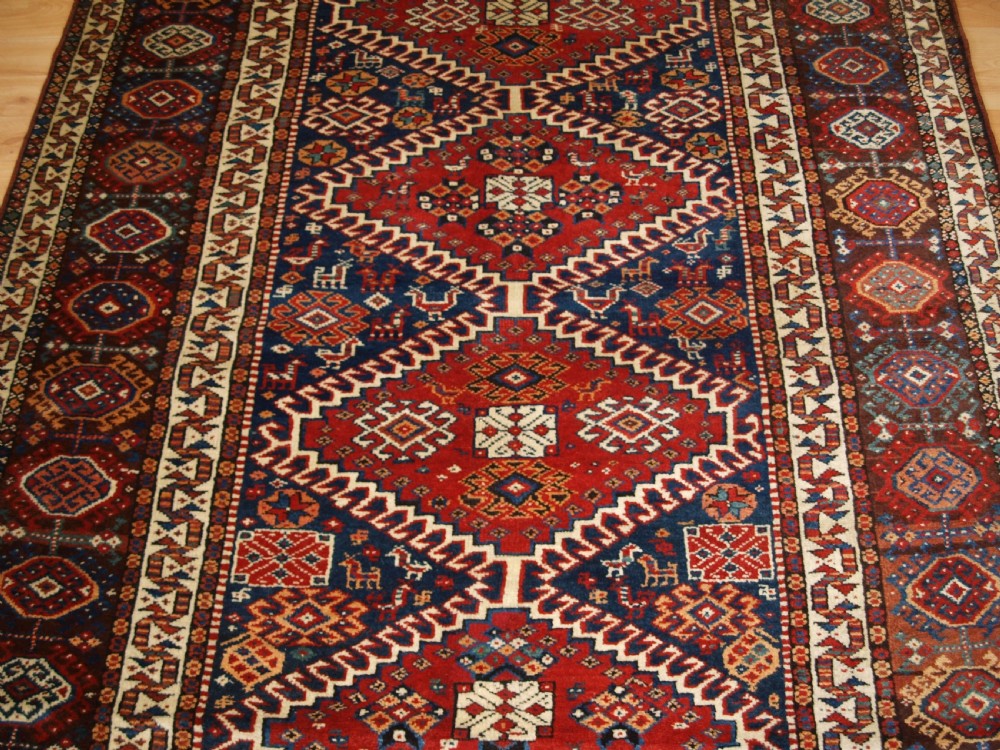 ANTIQUE RUG BY THE LURI TRIB, OUTSTANDING CONDITION, CIRCA 1900. View VI
