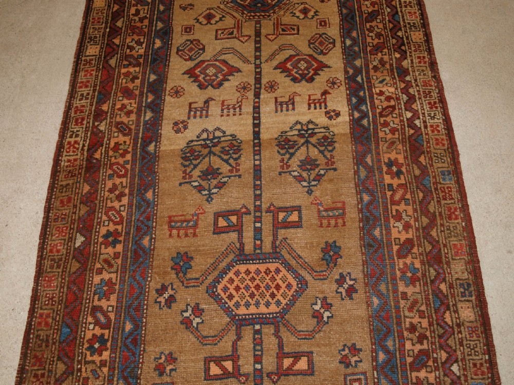 ANTIQUE NORTH WEST PERSIAN KURDISH RUNNER, CAMEL GROUND, LOTS OF ANIMALS, CIRCA 1900. View IV