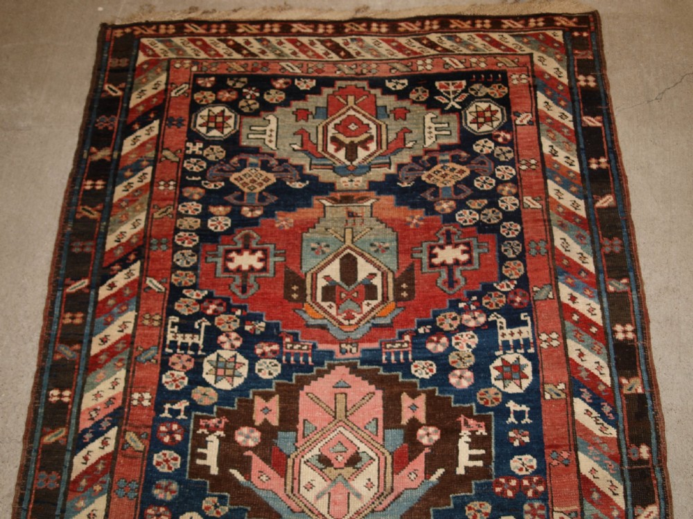 ANTIQUE SOUTH EAST CAUCASIAN RUNNER, SOFT COLOURS, PEOPLE AND ANIMALS, CIRCA 1900. View II