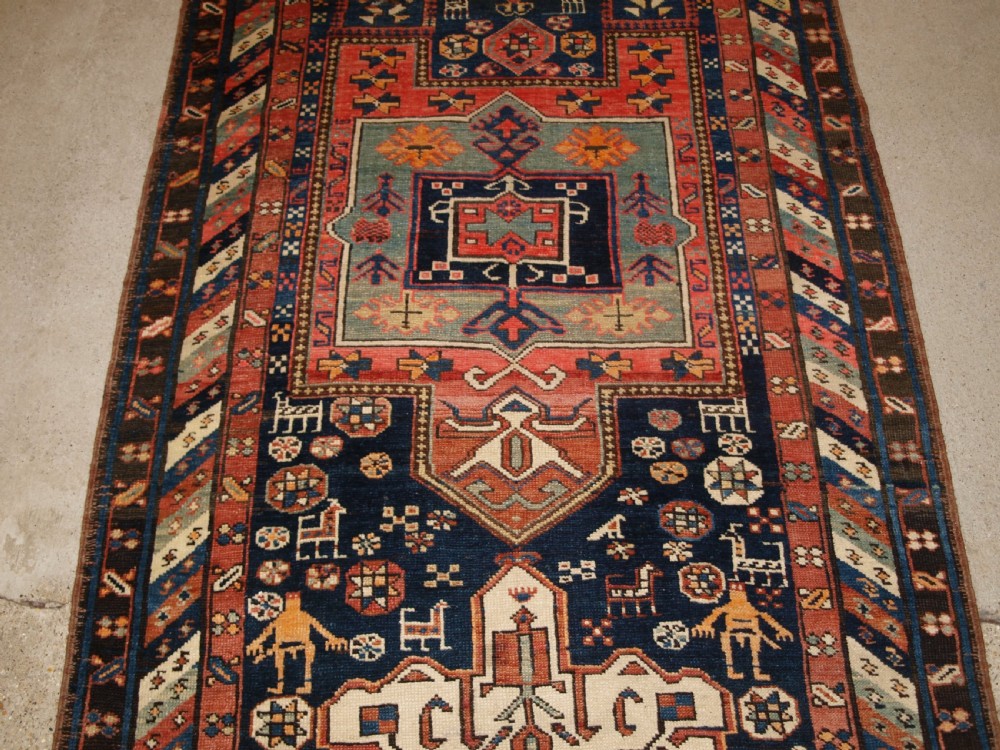 ANTIQUE SOUTH EAST CAUCASIAN RUNNER, SOFT COLOURS, PEOPLE AND ANIMALS, CIRCA 1900. View IV